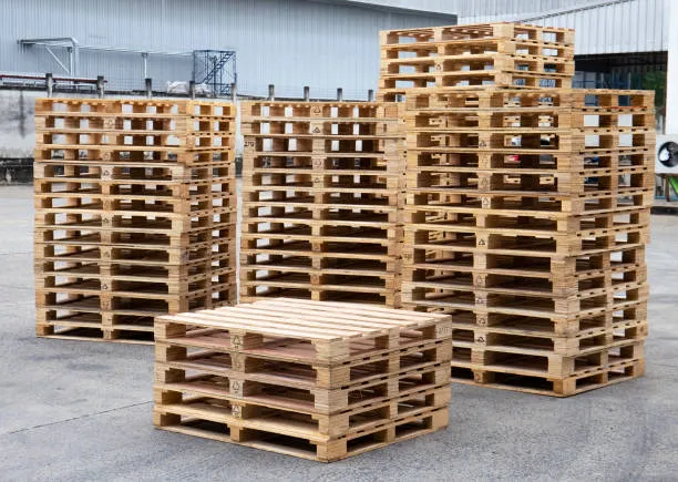 Stacked wooden pallets ready for pickup